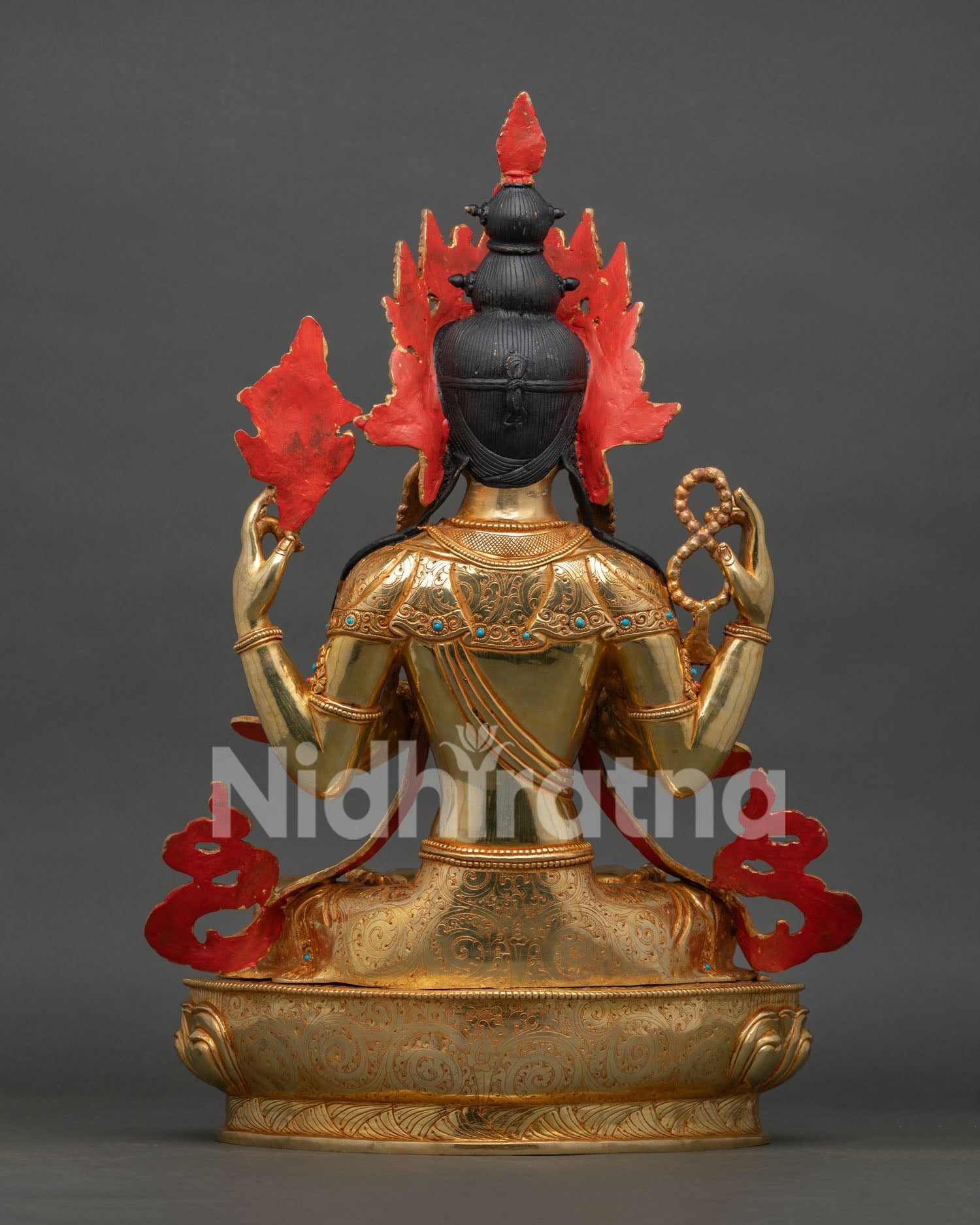 back view of chenrezig statue showing handcrafted copper craftsmanship and lotus base