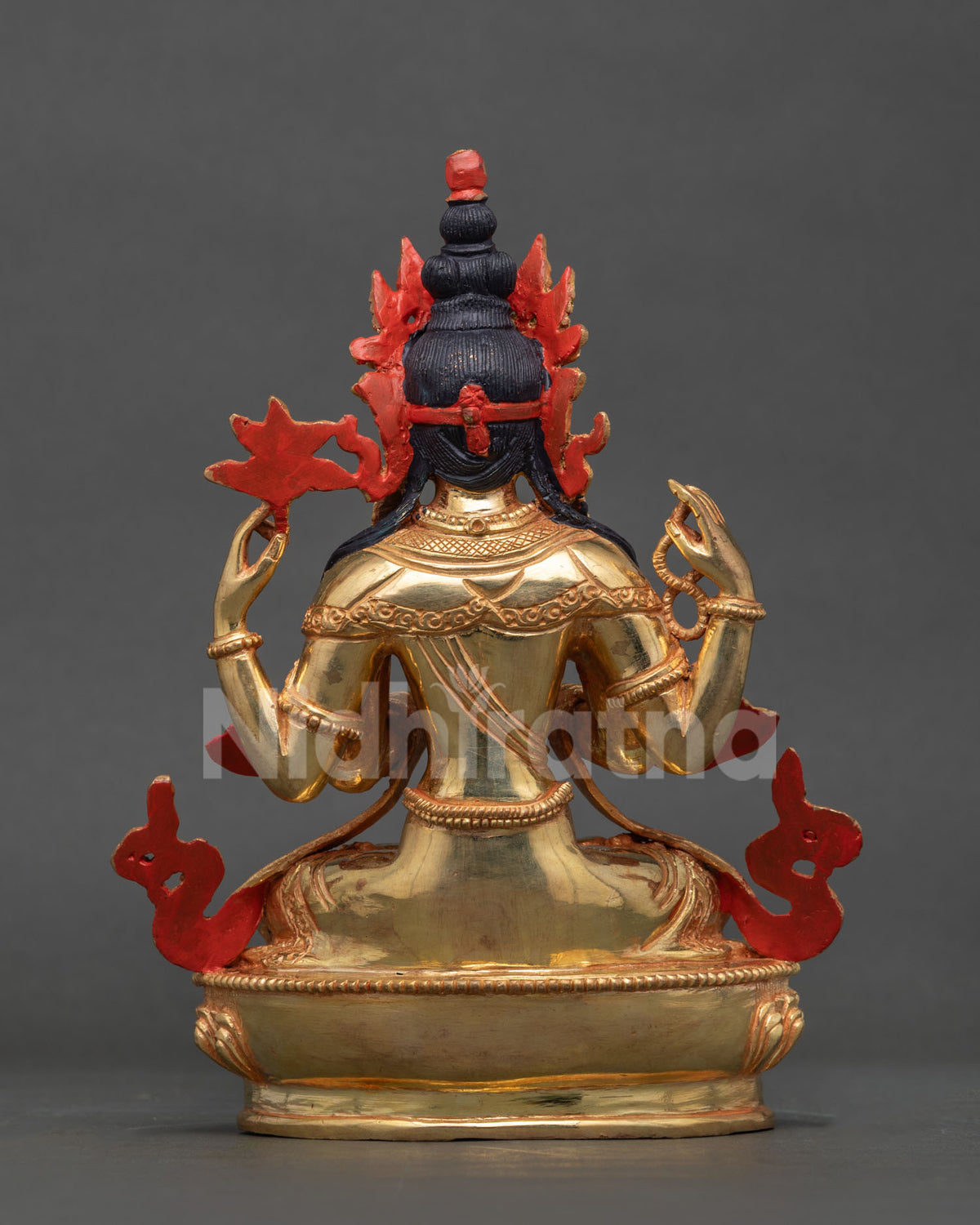 Back view of Chenrezig statue with red painted backing, gold back detail and lotus base, Nepal