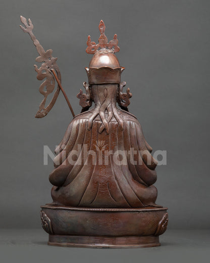 Back view of copper Guru Tsokye Dorje statue displaying rear Newari craftsmanship