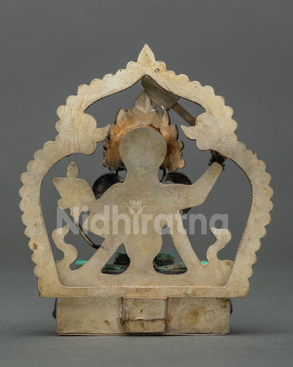 Back view of copper Manjushri statue from Nepal showing Newari craftsmanship and halo