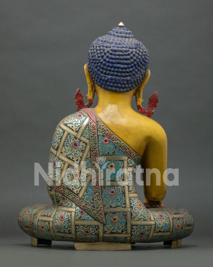 Back view of copper Shakyamuni Buddha statue showing detailed robe carvings and Himalayan artistry