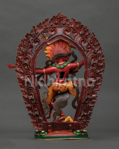 Back view of Dancing Kurukulla copper statue with ornate robes, halo and lotus base