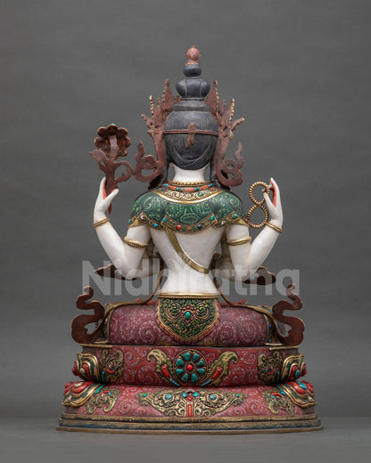 Back view of detailed copper craftsmanship on four-armed Chenrezig