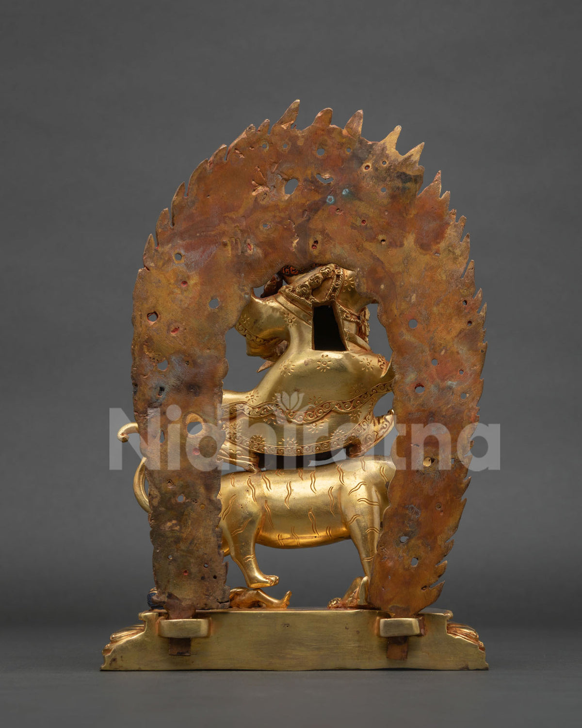 Back view of Dorje Drolo statue with detailed copper casting and gold gilding