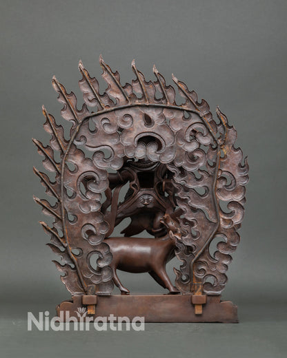 Back view of Dorje Gotrab statue Himalayan sacred sculpture with intricate flame detailing copper craftsmanship and traditional Newari artisan