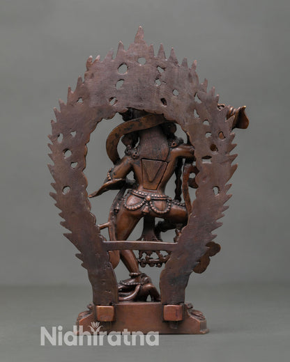 Back view of Dorje Phagmo statue showing khatvanga staff detail, handmade Nepalese Buddhist sculpture in oxidized finish for meditation altar decor.