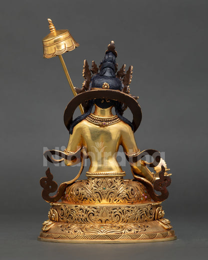 Back view of Dukkar White Umbrella Goddess statue with ornate repoussé and chased details