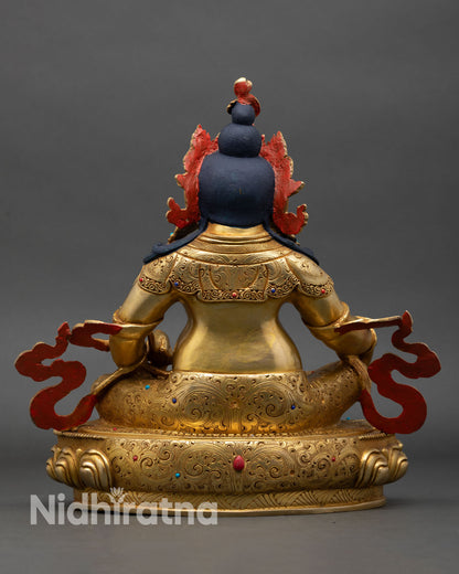 Back view of Dzambhala statue intricate carvings traditional Nepalese craftsmanship