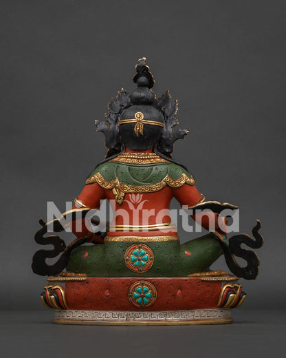 Back view of Dzambhala statue showing etched green robes, black topknot, and detailed gold lotus base.