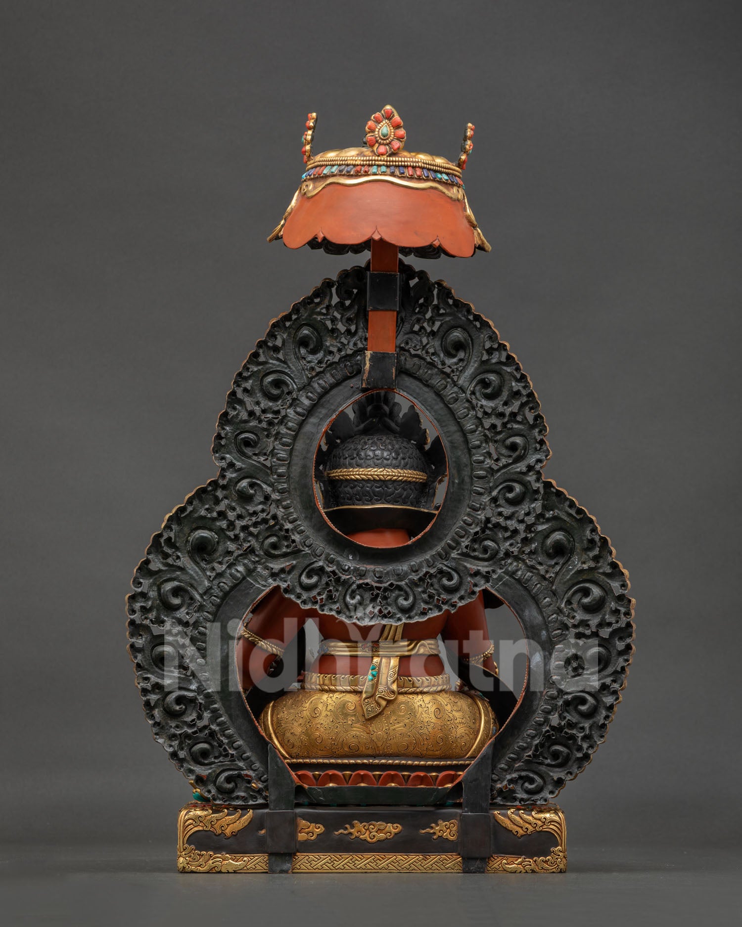 Back view of Dzambhala Statue showing gold gilded throne and Himalayan Buddhist artistry
