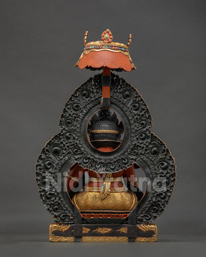 Back view of Dzambhala Statue showing gold gilded throne and Himalayan Buddhist artistry