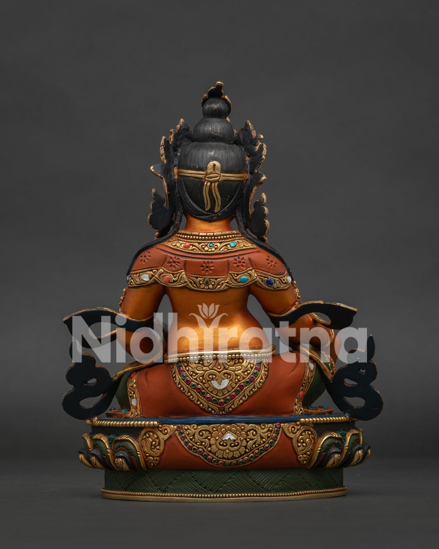Back view of Dzambhala Statue showing hand-carved lotus pedestal base