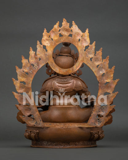 Back view of Dzambhala statue with detailed carvings and traditional Newari craftsmanship
