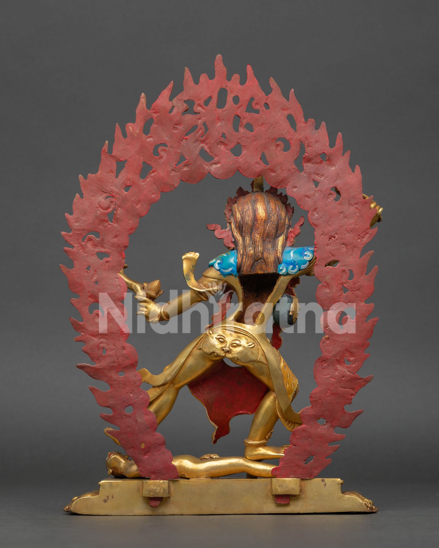 Back view of Ekajati statue, revealing detailed flame halo carvings and handcrafted Nepalese Buddhist artwork