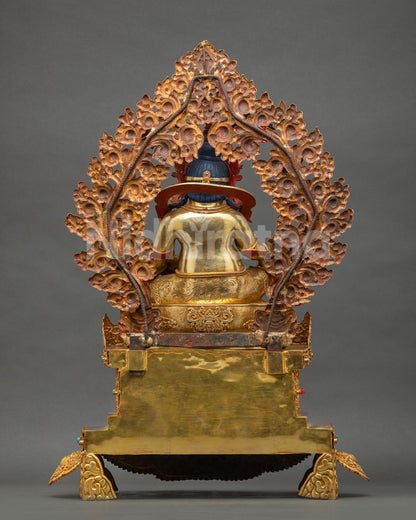 Back view of enthroned Yellow Dzambhala statue with foliage aureole and 24K gold fire-gilded copper base