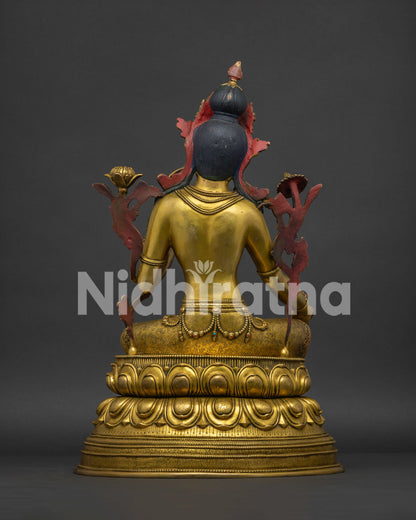 Back view of fire gilded Green Tara statue revealing carved double lotus base.