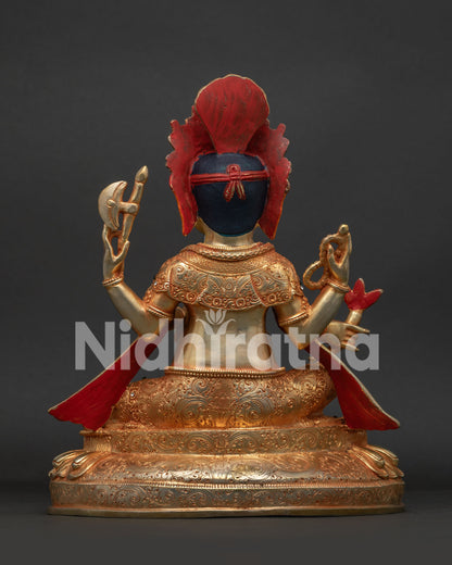 Back view of Ganesh statue showing sacred serpent drape and hand-chased engravings