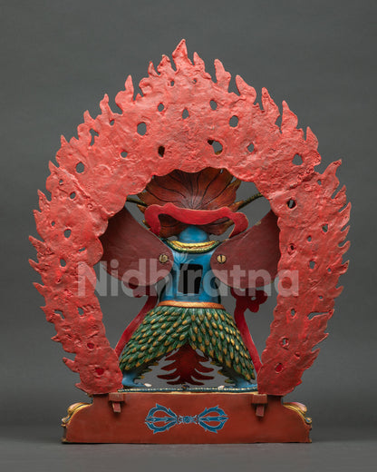 Back view of Garuda statue showing copper base and lotus pedestal