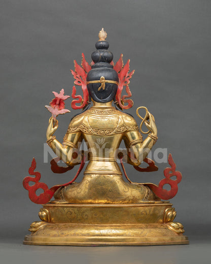 Back view of gilded copper Chenrezig statue with hand-engraved robe and sculpted hair bun