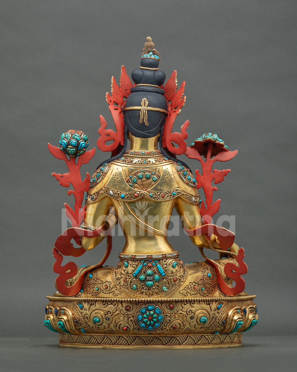 Back view of gold gilded Green Tara statue with intricate engraved detailing and lotus base from Nepal