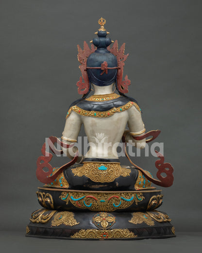 Back view of grand Vajrasattva Dorje Sempa statue, blue-black ushnisha, gold repoussé lower robe, stupa crown finial