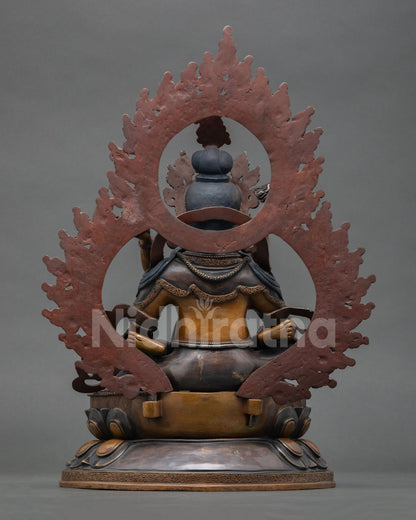 back view of green dzambhala copper statue with carved halo and detailed craftsmanship