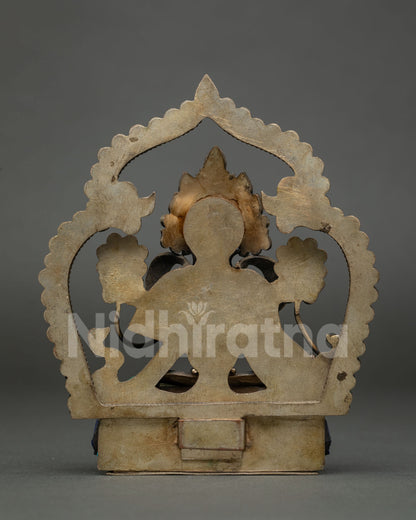 Back view of Green Tara copper statue showing handcrafted halo and pedestal from Nepal