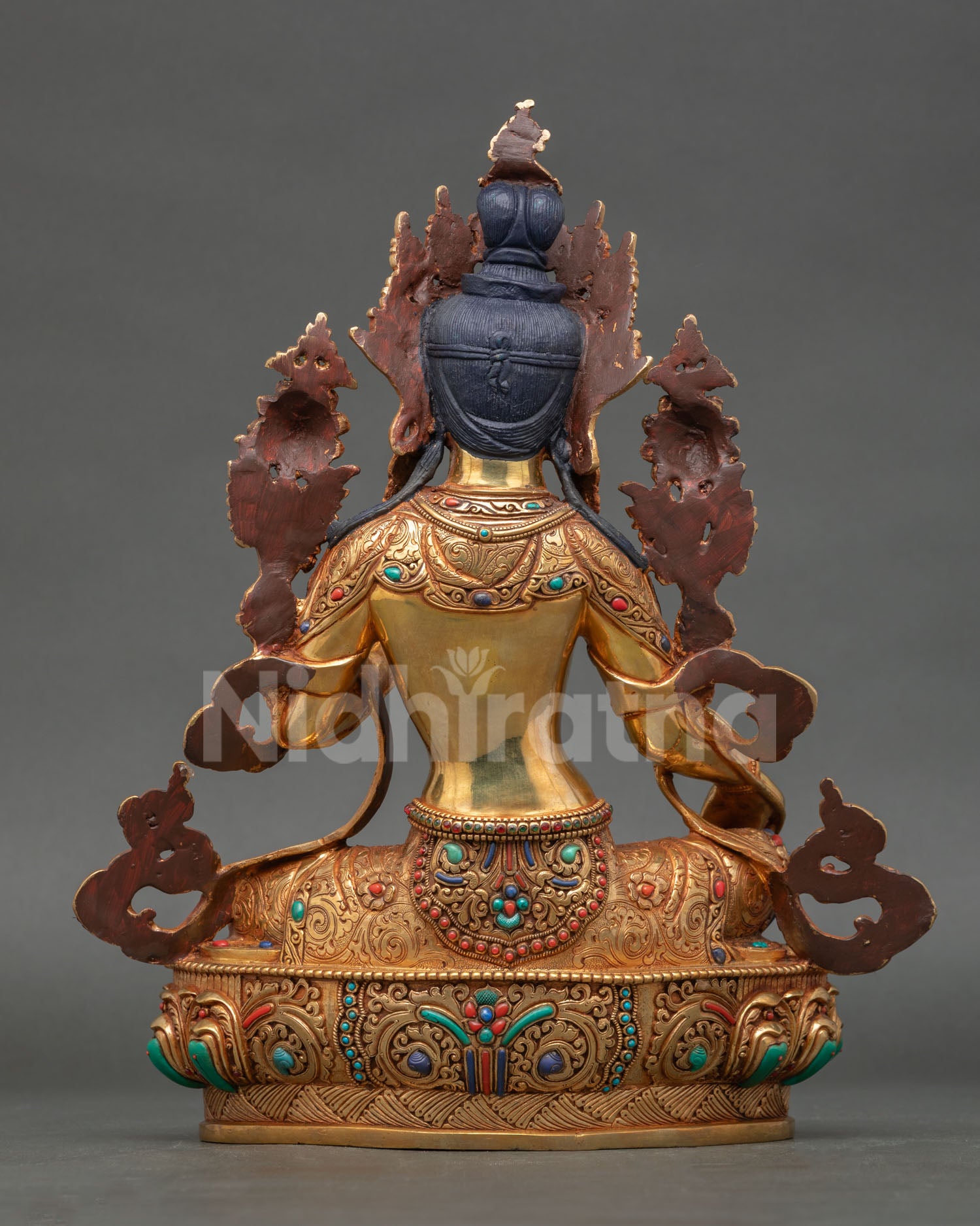 Back view of Green Tara statue handcrafted in copper with triple layer gold gilding finish showing detailed robe carving and sacred Buddhist meditation sculpture design.