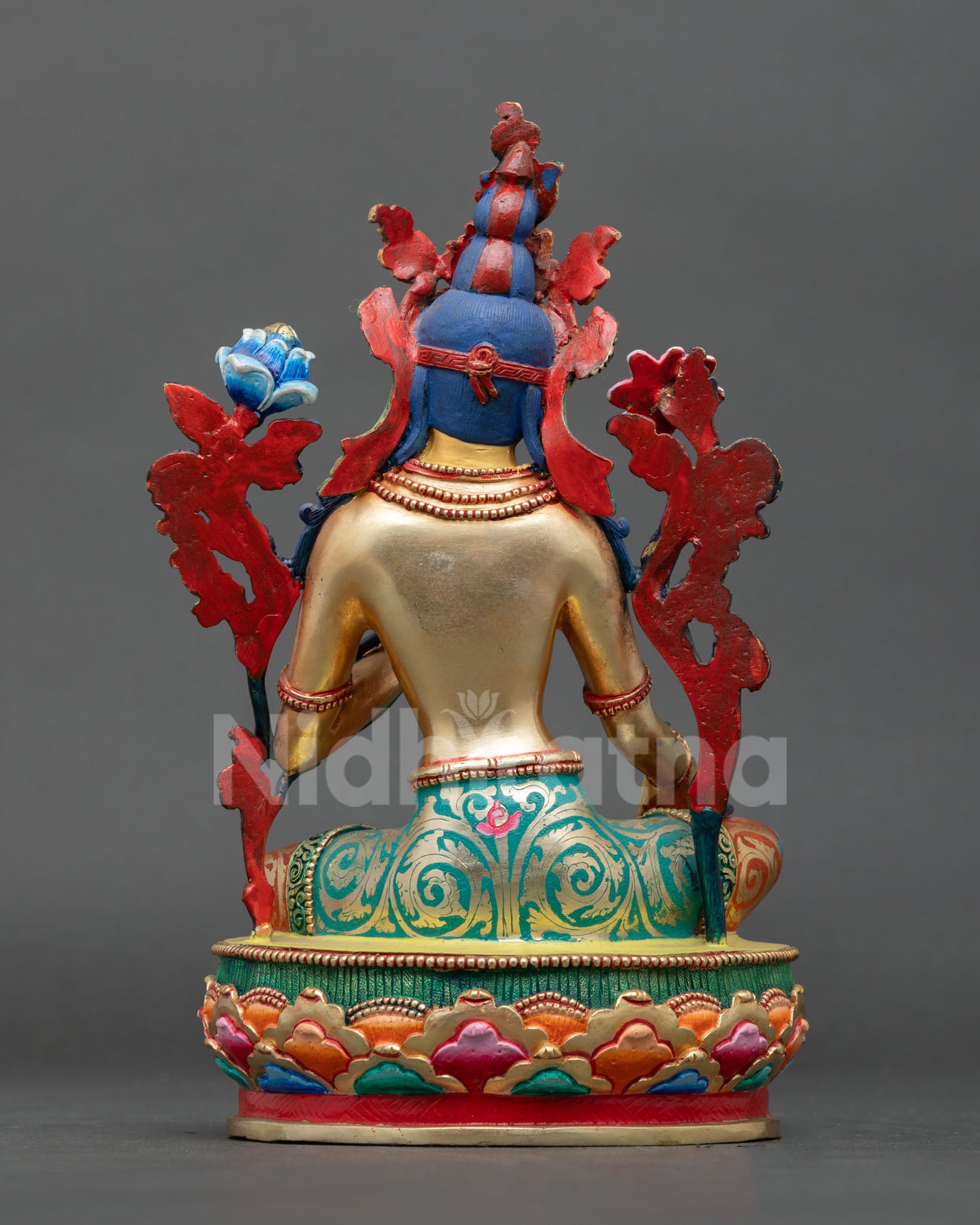 back view of green tara statue, detailed lotus base and traditional nepalese artisan metalwork
