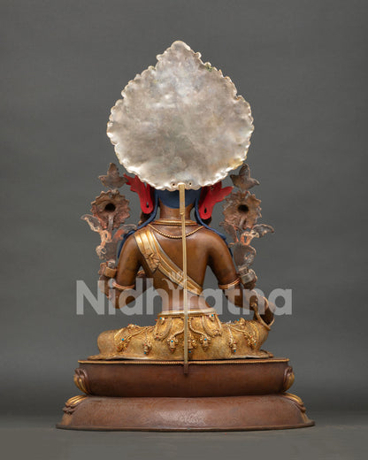 Back view of green tara statue featuring engraved halo and handcrafted copper artwork