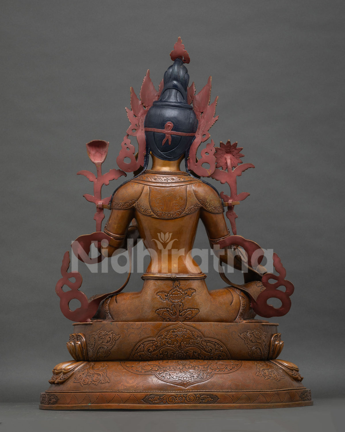 Back view of Green Tara statue, five-leaf crown detail, oxidized Newari copper craftsmanship