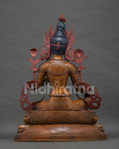 Back view of Green Tara statue, five-leaf crown detail, oxidized Newari copper craftsmanship