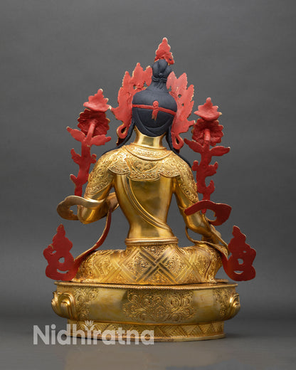 Back view of Green Tara statue flowing robes and intricate hand engraving