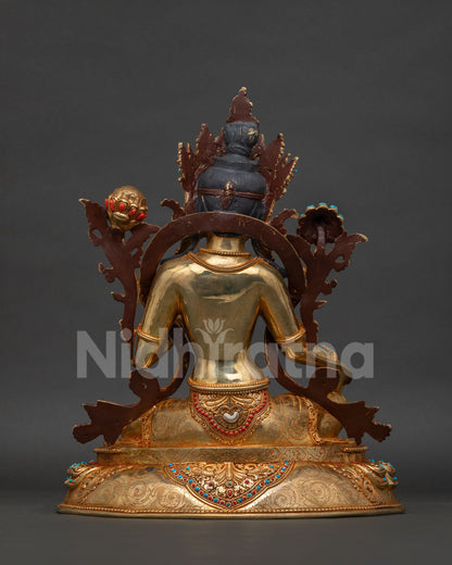 Back view of Green Tara statue, gold-gilded lotus pedestal