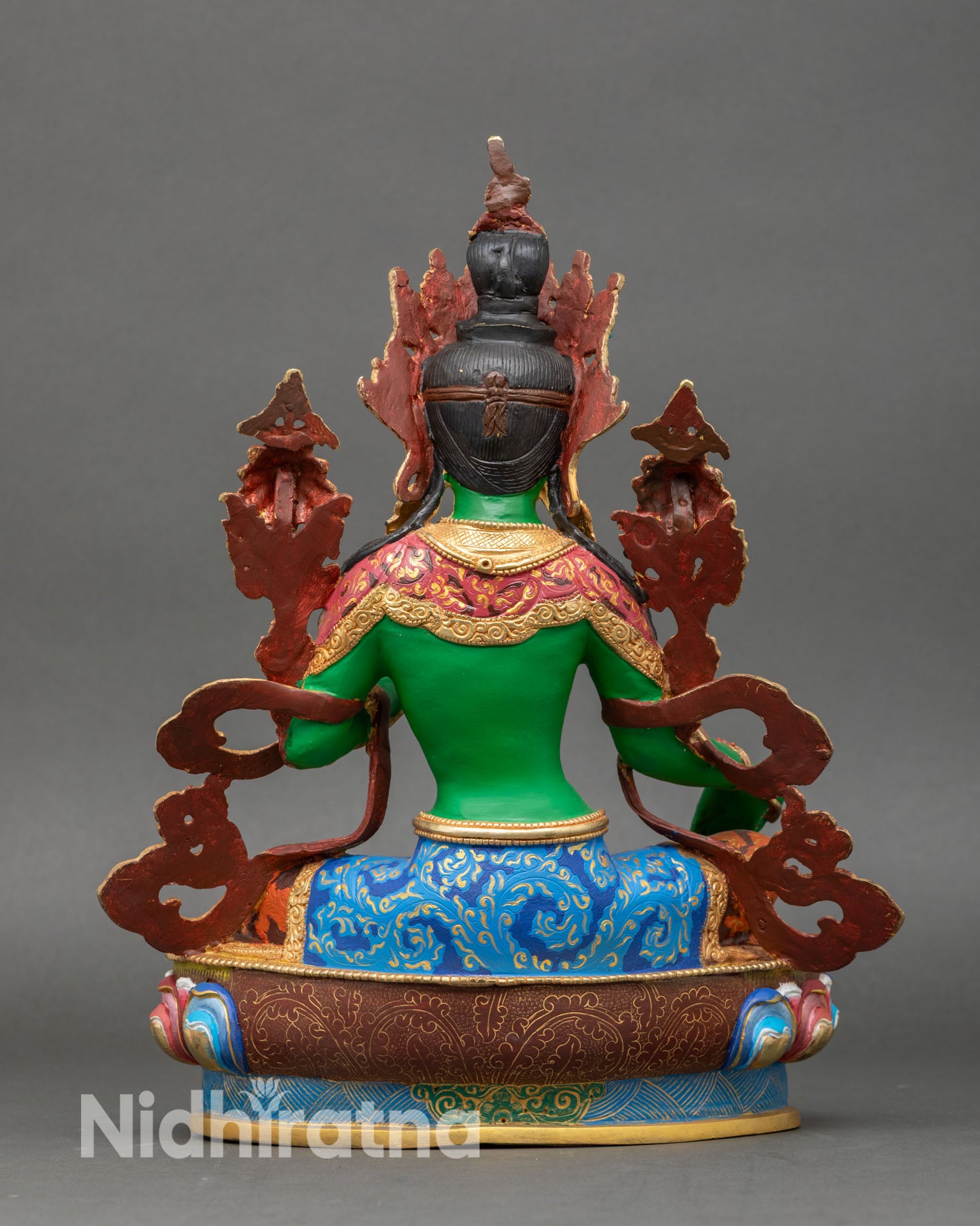 Back view of Green Tara statue, hand-painted copper with lotus pedestal and gold ornament highlights