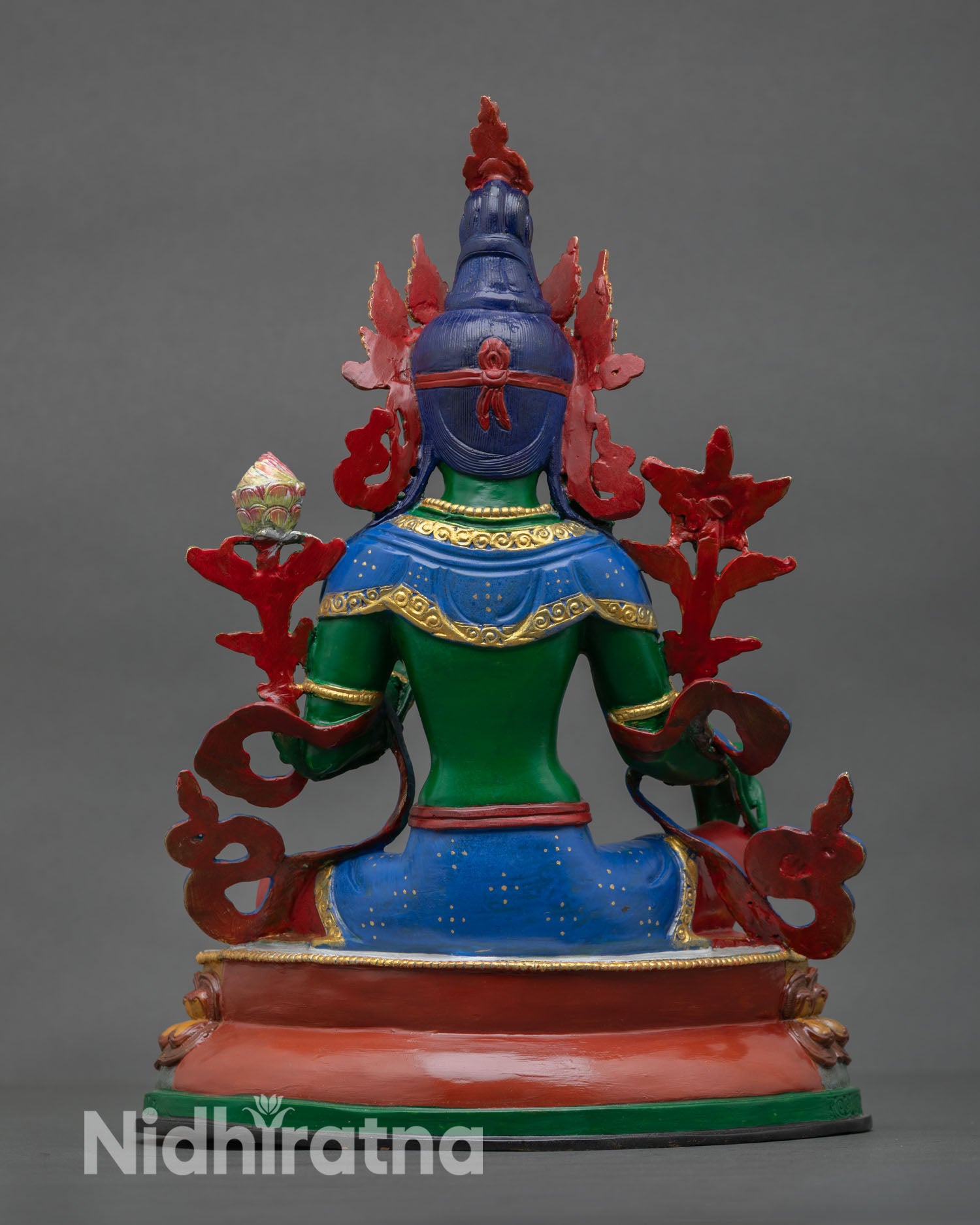 Back view of Green Tara statue highlighting detailed Himalayan craftsmanship hand painted finishing and ornate copper work.