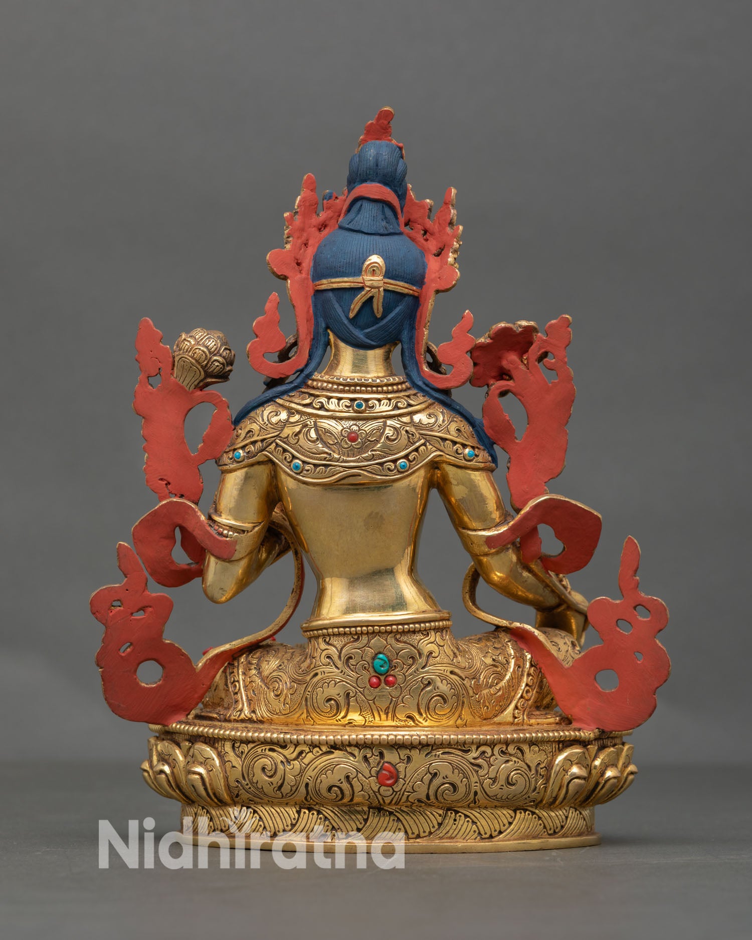 Back view of Green Tara statue highlighting intricate floral carvings, traditional lost wax casting detail, and Himalayan Buddhist art design
