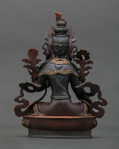 Back view of Green Tara statue highlighting intricate Himalayan artistry copper detailing and traditional hand painted finish.