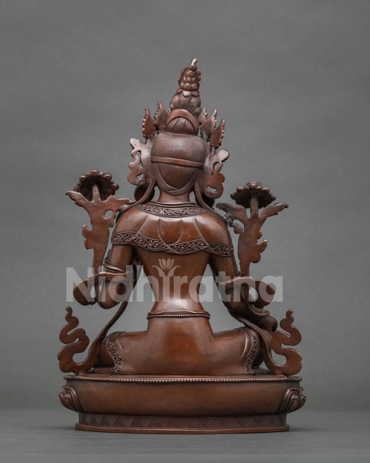Back view of Green Tara Statue highlighting intricate ornament carvings oxidized copper finish and Nepalese craftsmanship