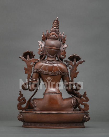 Back view of Green Tara Statue highlighting intricate ornament carvings oxidized copper finish and Nepalese craftsmanship