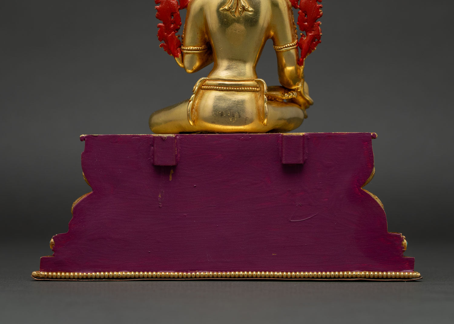 Back view of Green Tara statue seated on hand-carved double lotus pedestal
