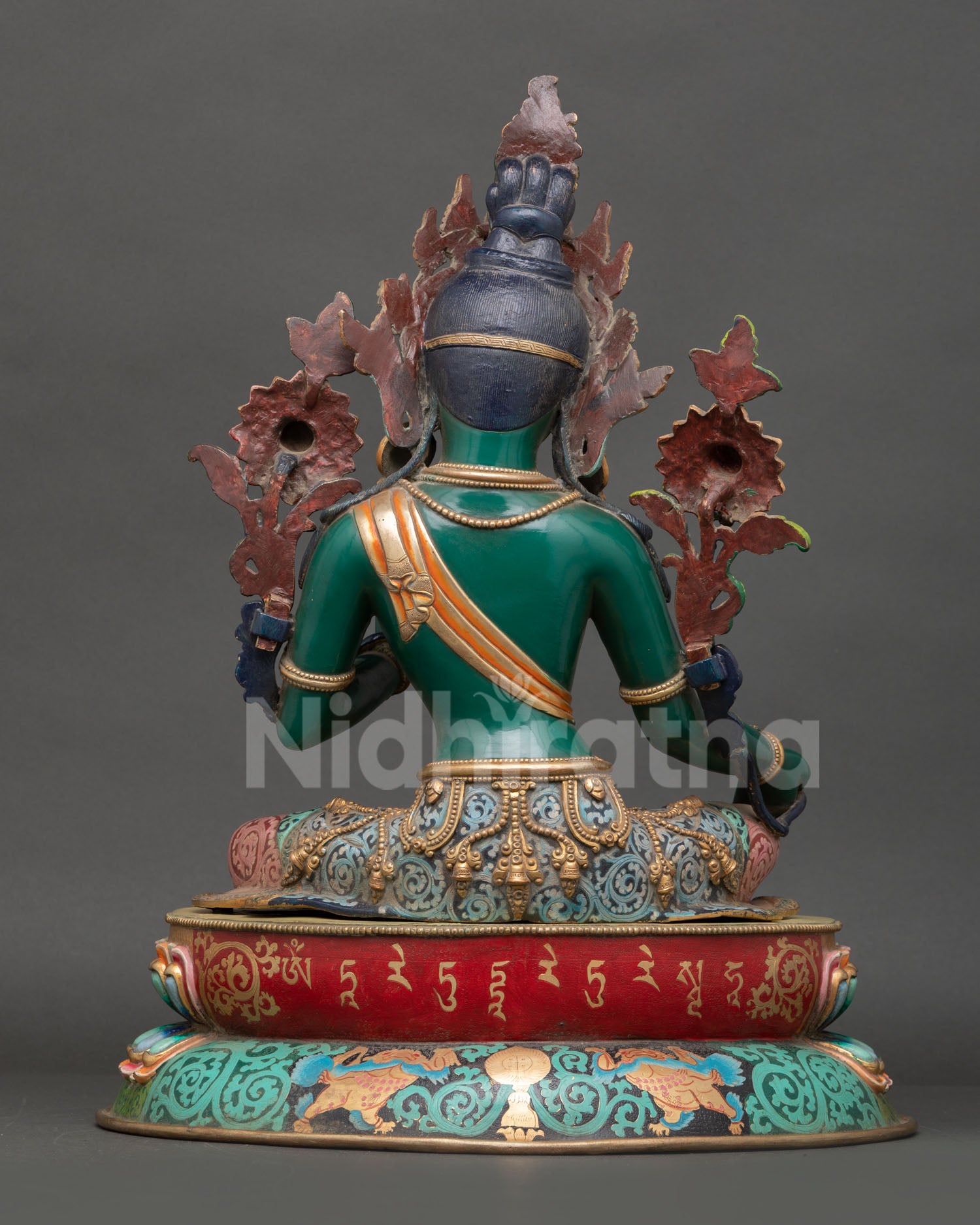 Back view of Green Tara statue showing detailed carving, acrylic finish and lotus throne design