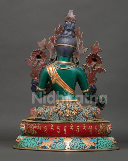 Back view of Green Tara statue showing detailed carving, acrylic finish and lotus throne design