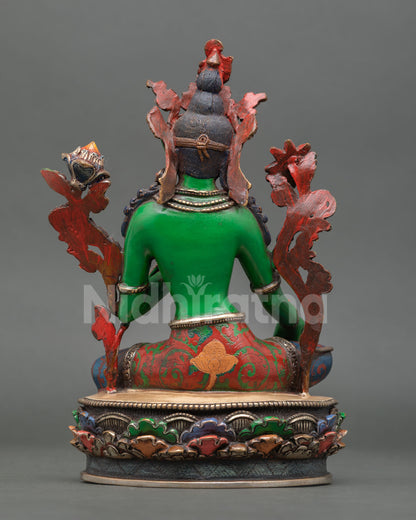 back view of green tara statue showing detailed copper craftsmanship and painting