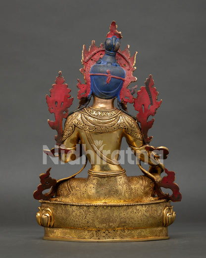 back view of green tara statue showing detailed ornaments and lotus throne engraving