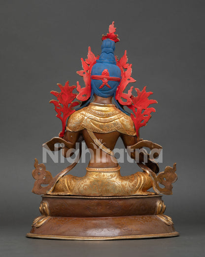 back view of green tara statue showing engraved copper details and sacred design