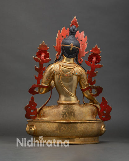 Back view of Green Tara statue showing engraved lotus seat and robe details
