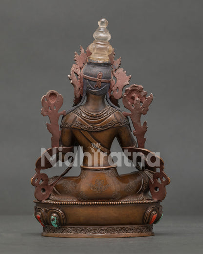 Back view of Green Tara Statue showing ornate sculptural details and lotus base