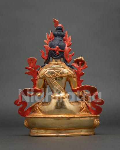 Back view of Green Tara statue showing painted red halo, gilded back and lotus pedestal