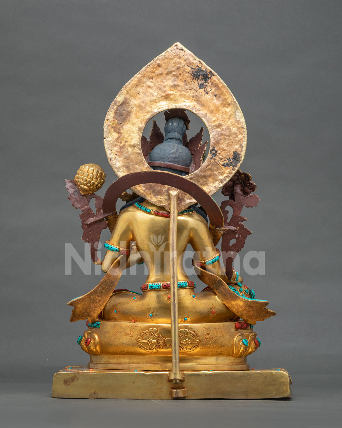 Back view of Green Tara statue with aureole, 24K gold fire gilded copper handcrafted in Nepal